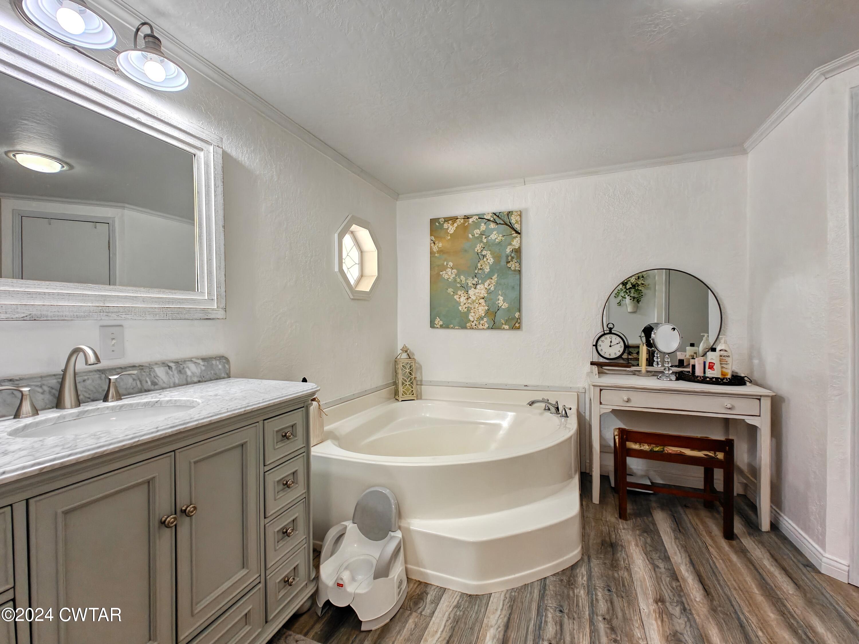 194 Mccadams Road McKenzie, TN 38201 - Photo 17 of 43 a bathroom with a sink and a mirror