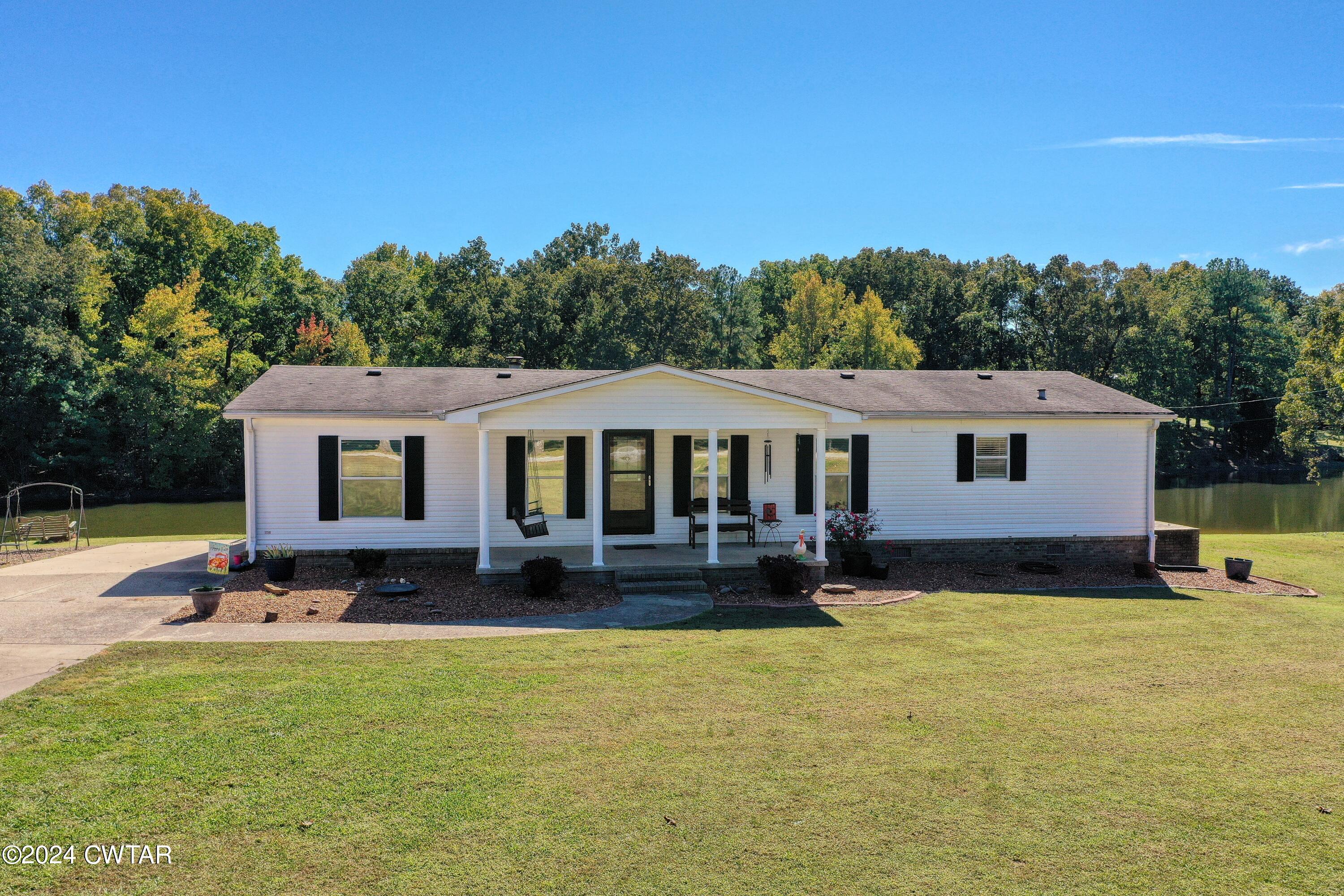 194 Mccadams Road McKenzie, TN 38201 - Photo 2 of 43 a view of a house with backyard and sitting area