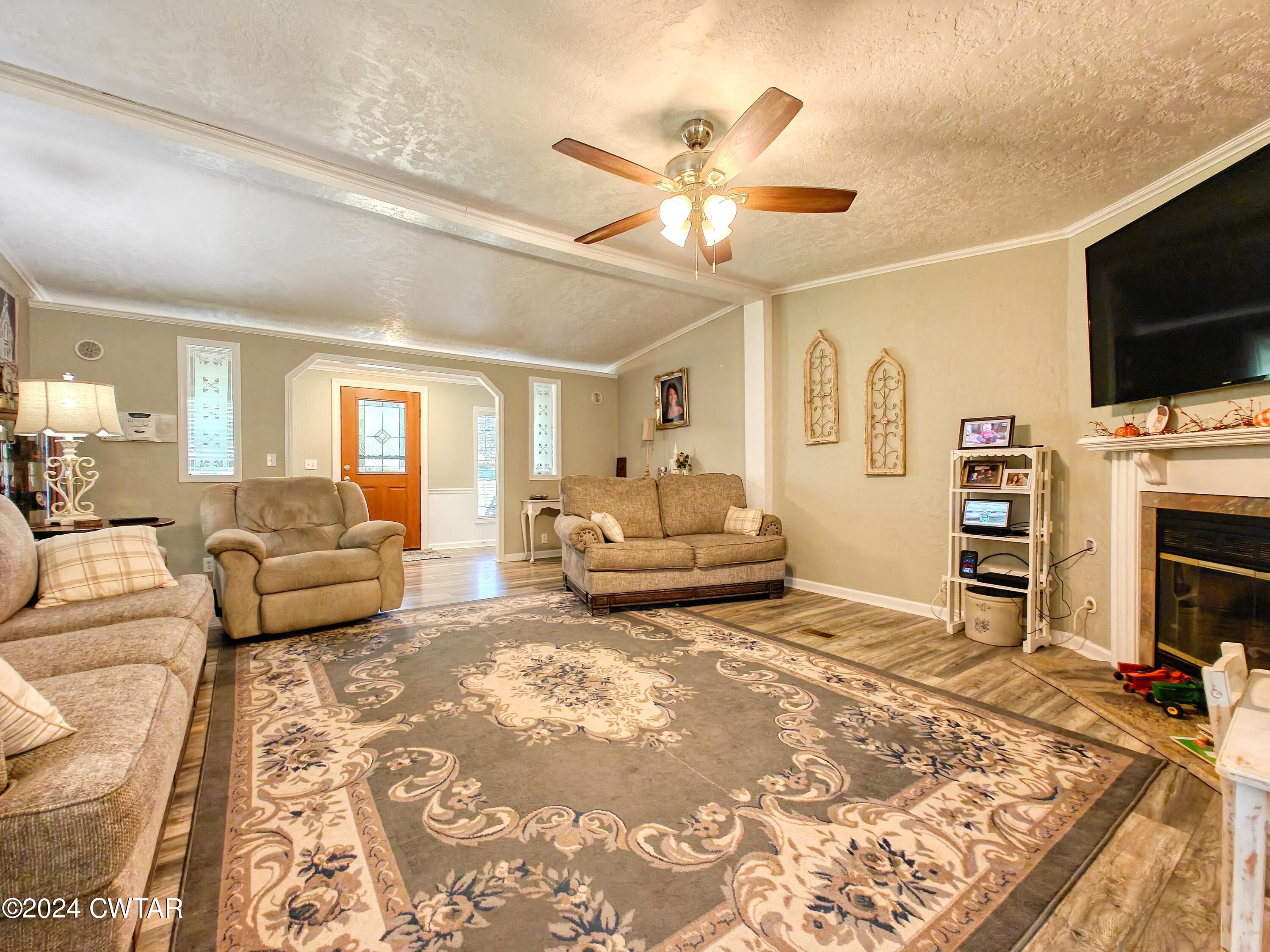 194 Mccadams Road McKenzie, TN 38201 - Photo 8 of 43 a living room with furniture and a flat screen tv