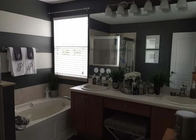 a bathroom with a sink a toilet and a bathtub