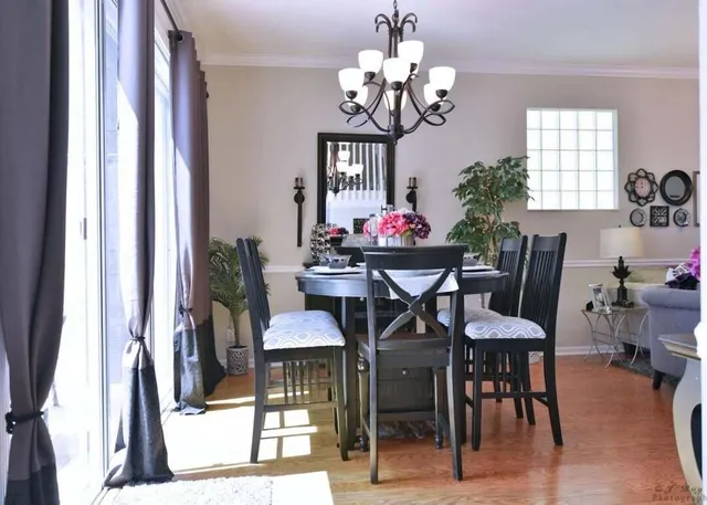 a view of a dining room with furniture and window