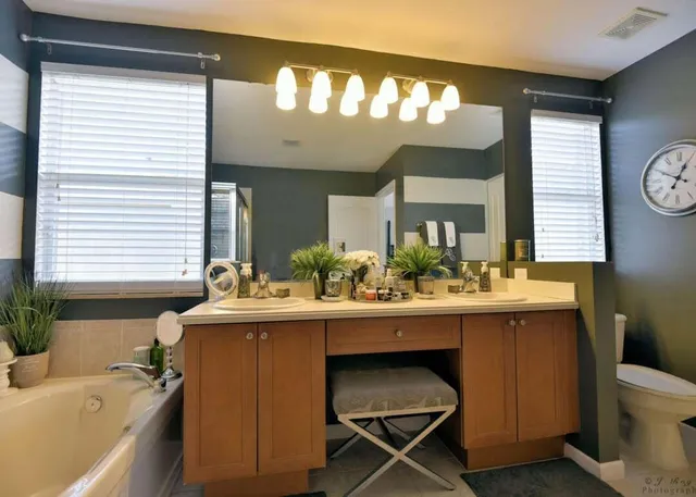 a view of a bathroom with a sink and mirror