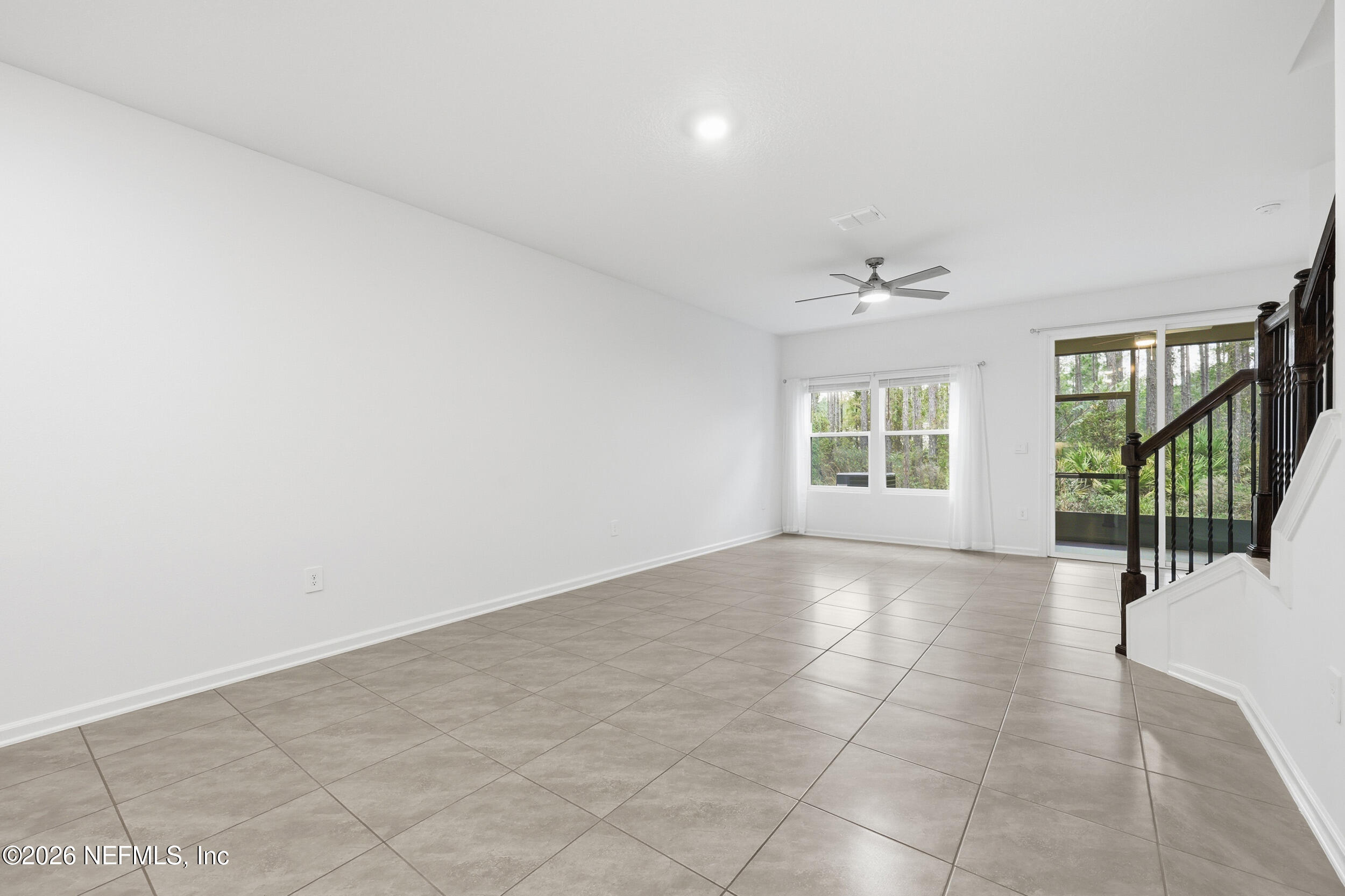 70 Barley Street St. Augustine, FL 32092 - Photo 14 of 40 wooden floor in an empty room with a window