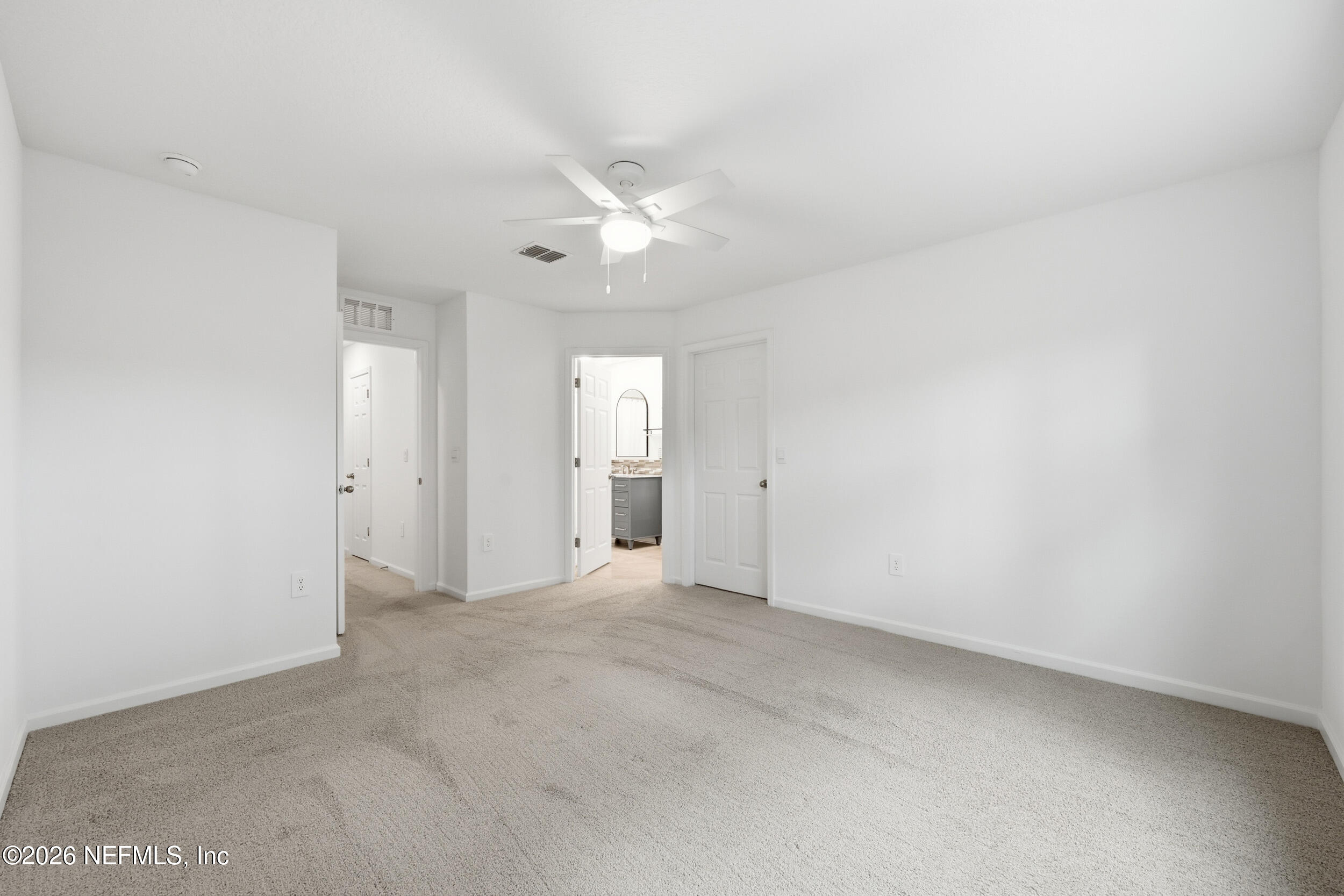 70 Barley Street St. Augustine, FL 32092 - Photo 22 of 40 an empty room with a ceiling fan and a window