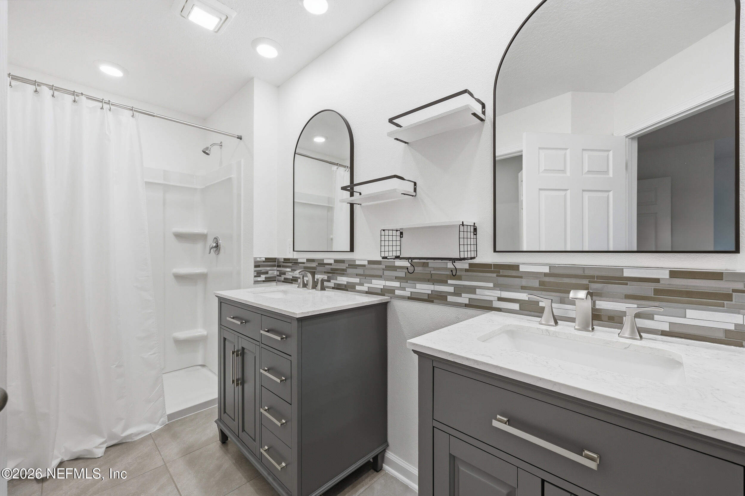 70 Barley Street St. Augustine, FL 32092 - Photo 23 of 40 a bathroom with a sink double vanity and a mirror