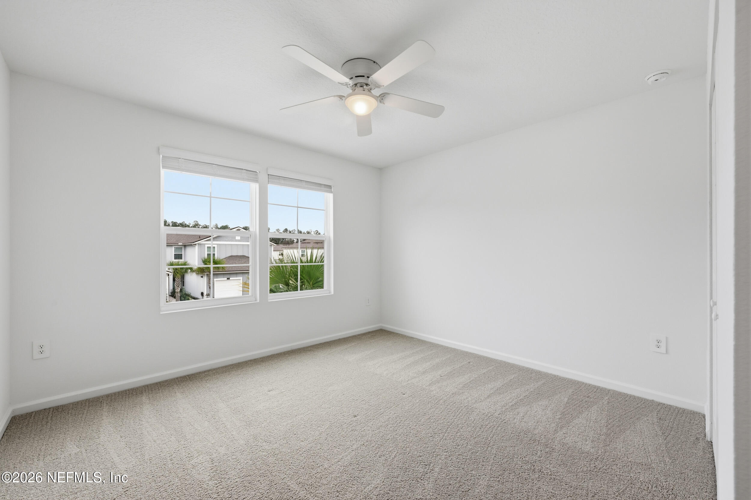 70 Barley Street St. Augustine, FL 32092 - Photo 28 of 40 an empty room with windows and fan