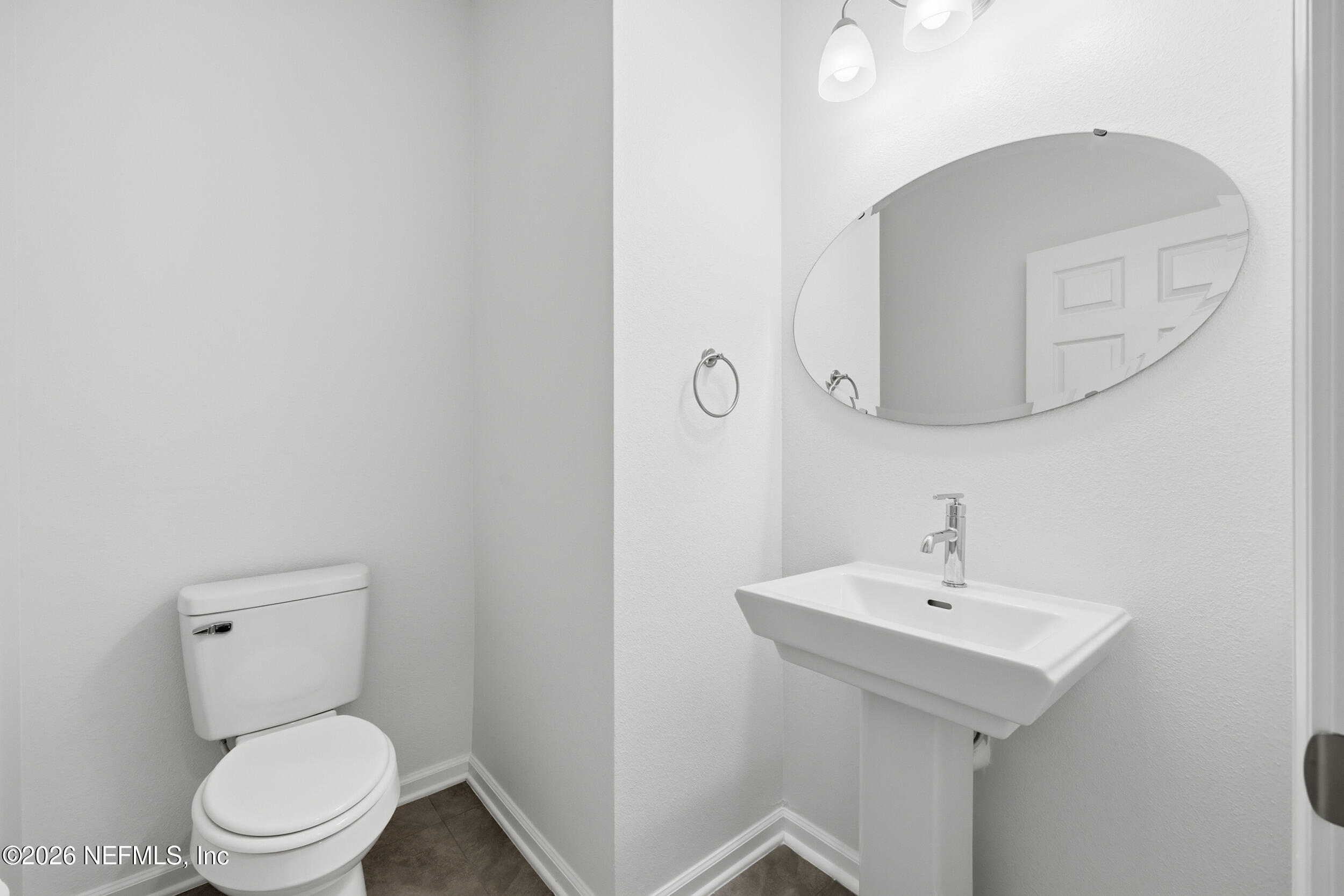 70 Barley Street St. Augustine, FL 32092 - Photo 30 of 40 a white toilet sitting next to a bathroom sink