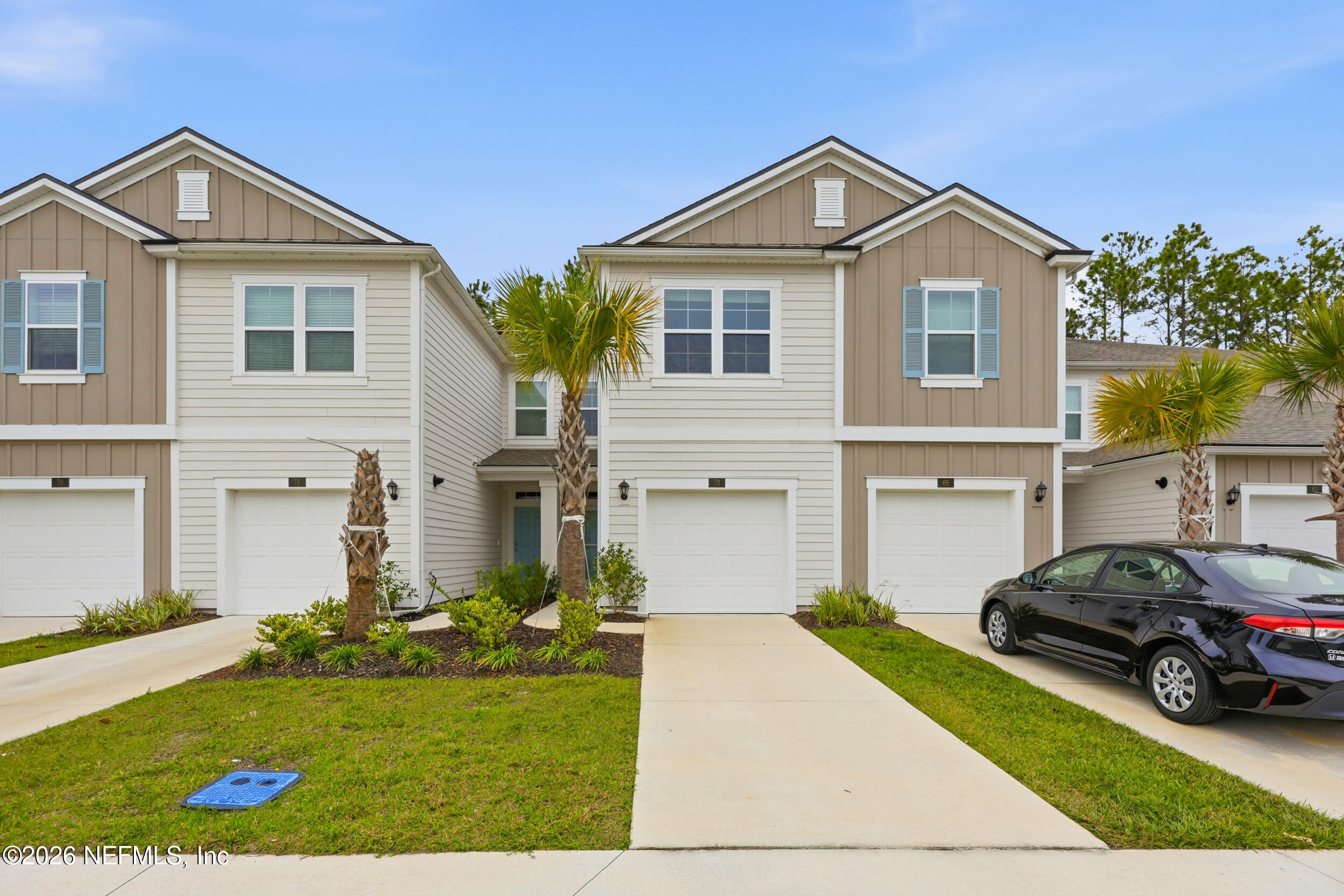 70 Barley Street St. Augustine, FL 32092 - Photo 34 of 40 a front view of a house with a yard and garage