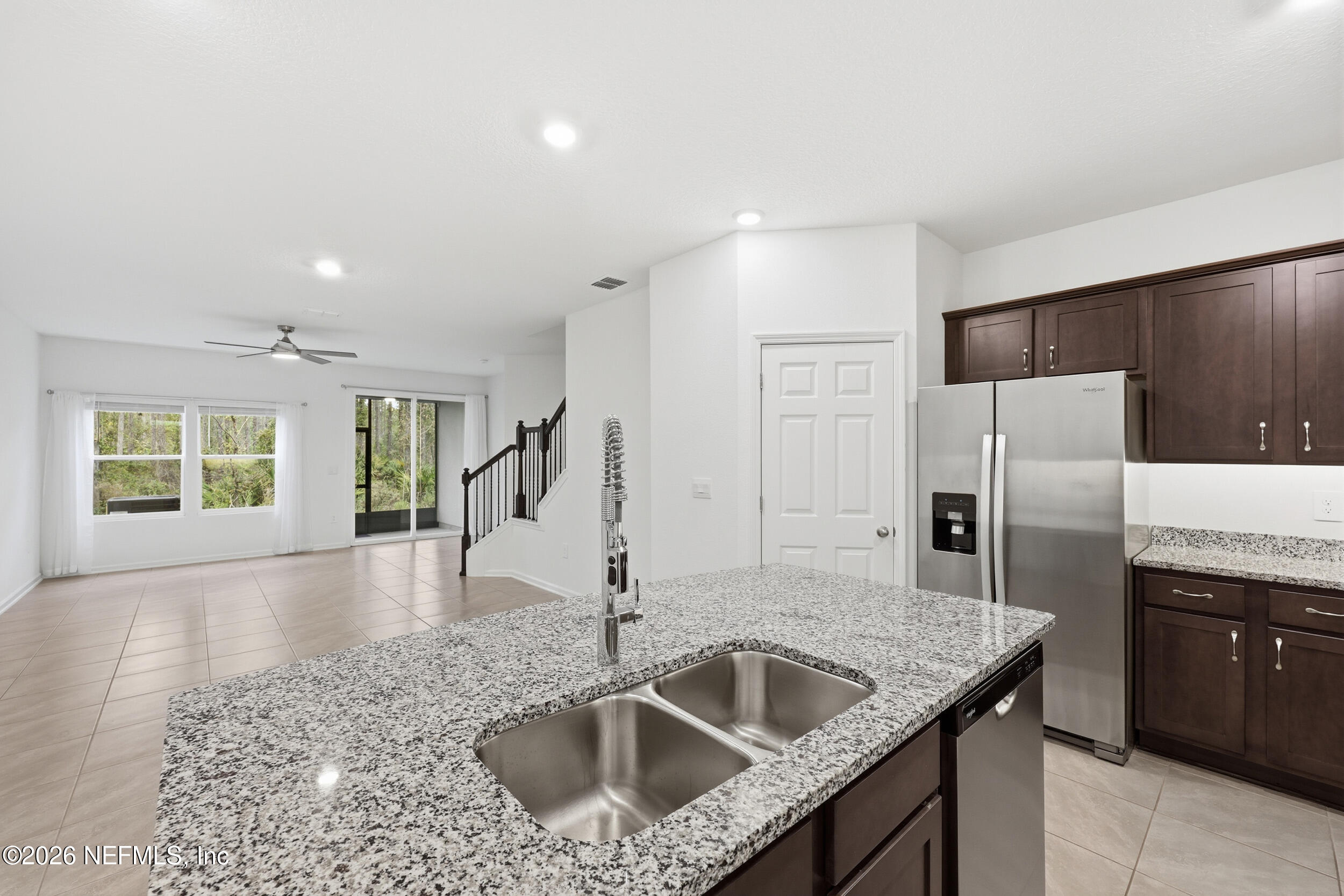 70 Barley Street St. Augustine, FL 32092 - Photo 10 of 40 a kitchen with stainless steel appliances granite countertop a sink a stove and a refrigerator
