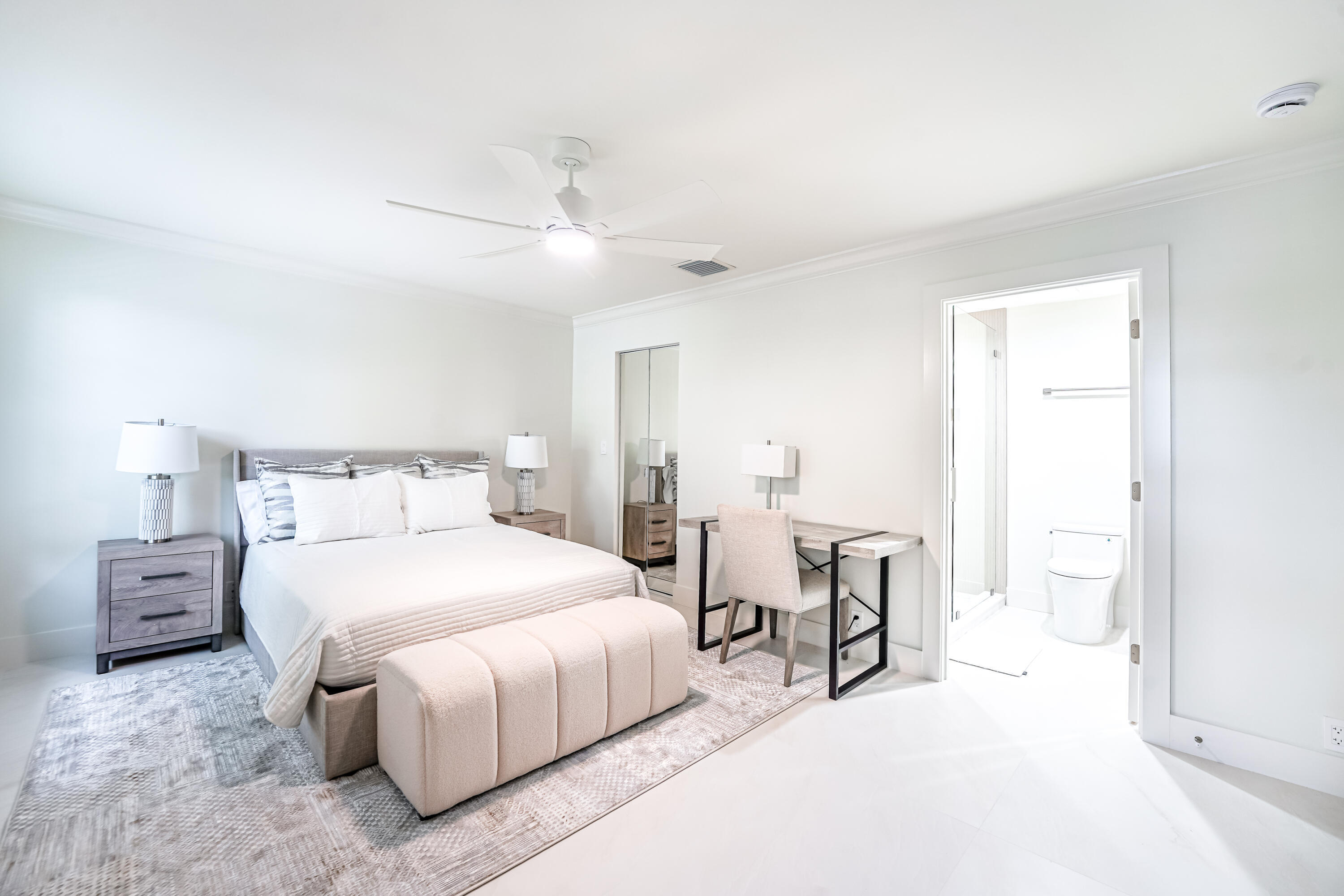 749 Northeast 71st Street Boca Raton, FL 33487 - Photo 31 of 43 a bedroom with a bed and a chandelier