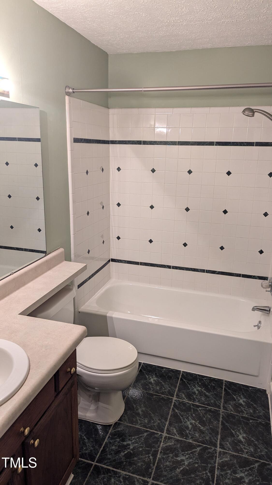 105 Broad Leaf Circle Raleigh, NC 27613 - Photo 15 of 19 a bathroom with a toilet a sink and bathtub