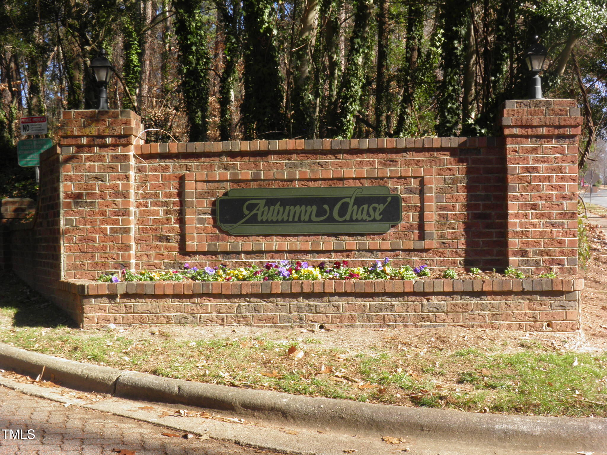 105 Broad Leaf Circle Raleigh, NC 27613 - Photo 19 of 19 a view of outdoor space with signage and flags
