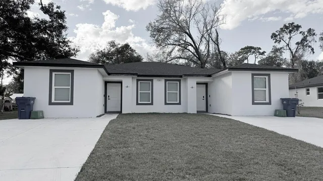 a house with trees in the background