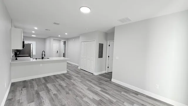 a view of kitchen with wooden floor