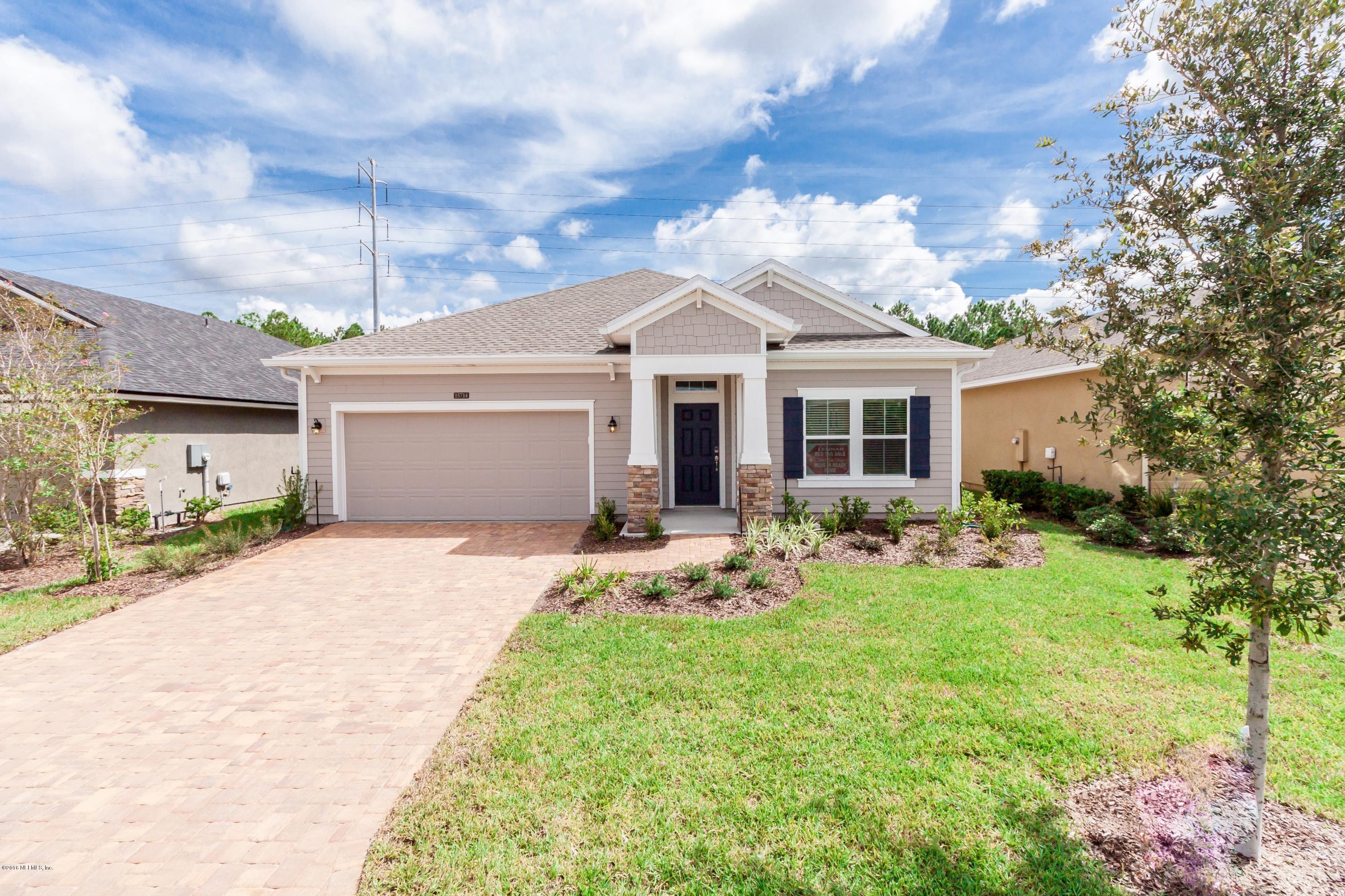 15714 Tisons Bluff Road Jacksonville, FL 32218 - Photo 1 of 44 a front view of a house with yard and green space
