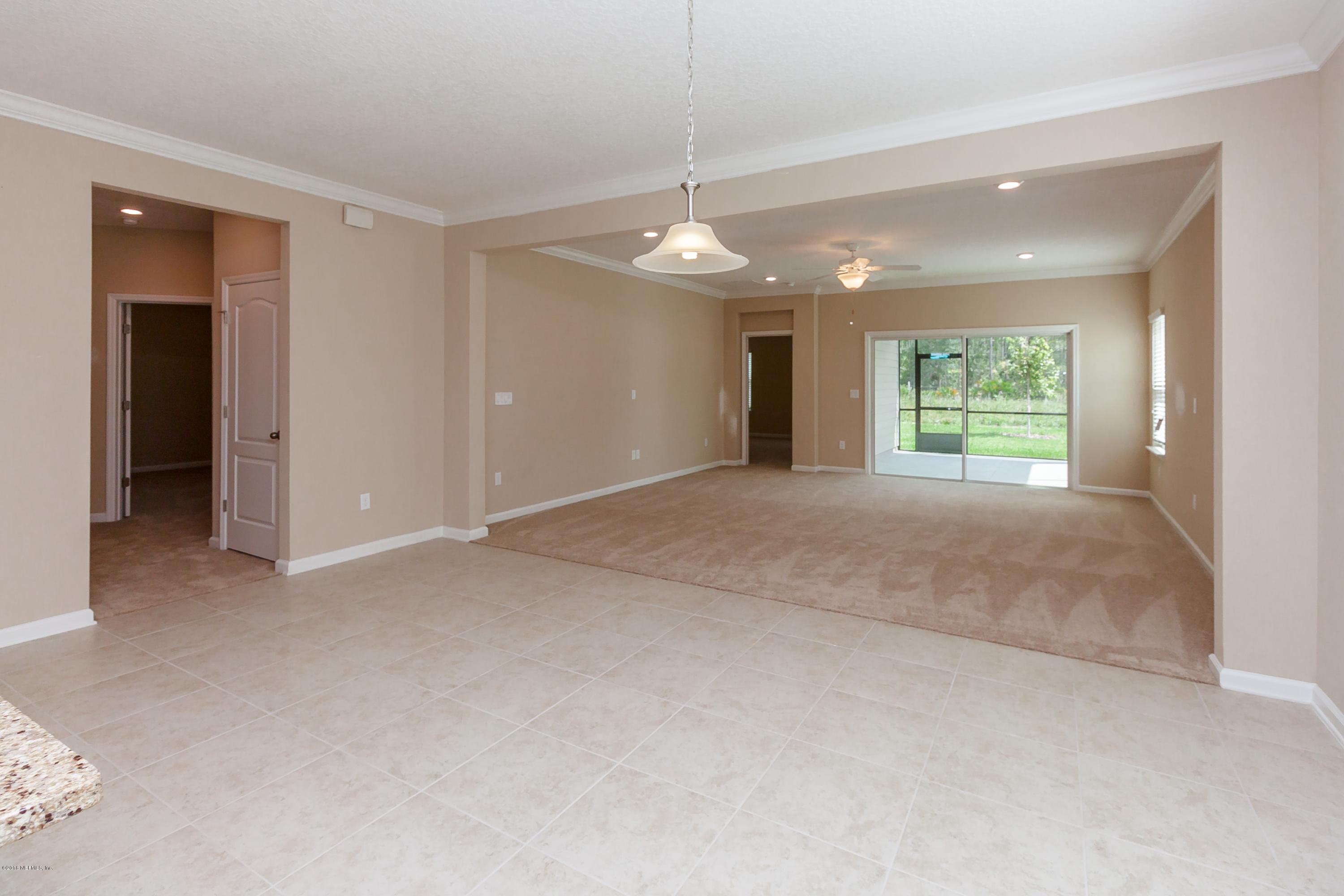 15714 Tisons Bluff Road Jacksonville, FL 32218 - Photo 14 of 44 a view of an empty room with window and cabinet