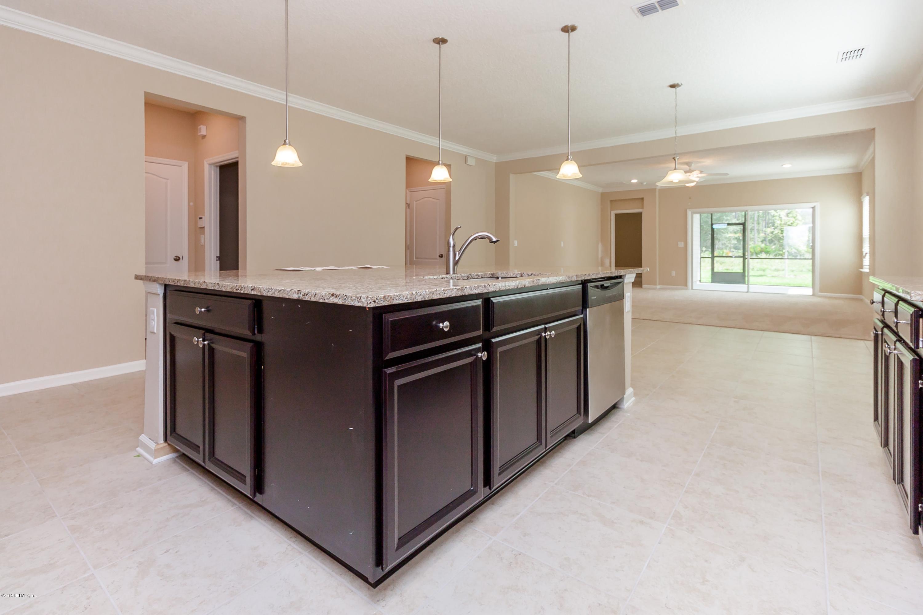15714 Tisons Bluff Road Jacksonville, FL 32218 - Photo 17 of 44 a kitchen with stainless steel appliances granite countertop a stove and a sink
