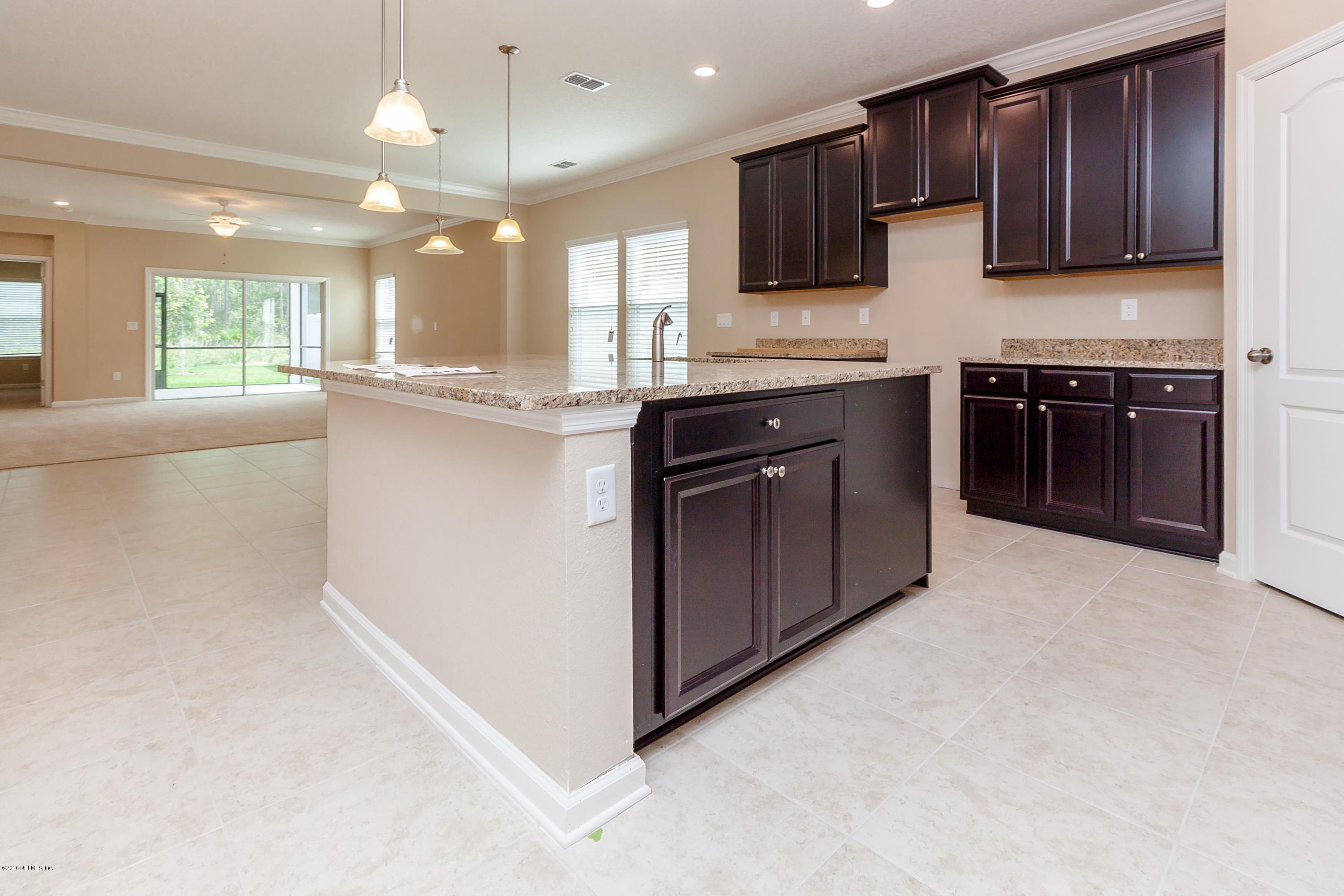 15714 Tisons Bluff Road Jacksonville, FL 32218 - Photo 18 of 44 a large kitchen with stainless steel appliances and large cabinets