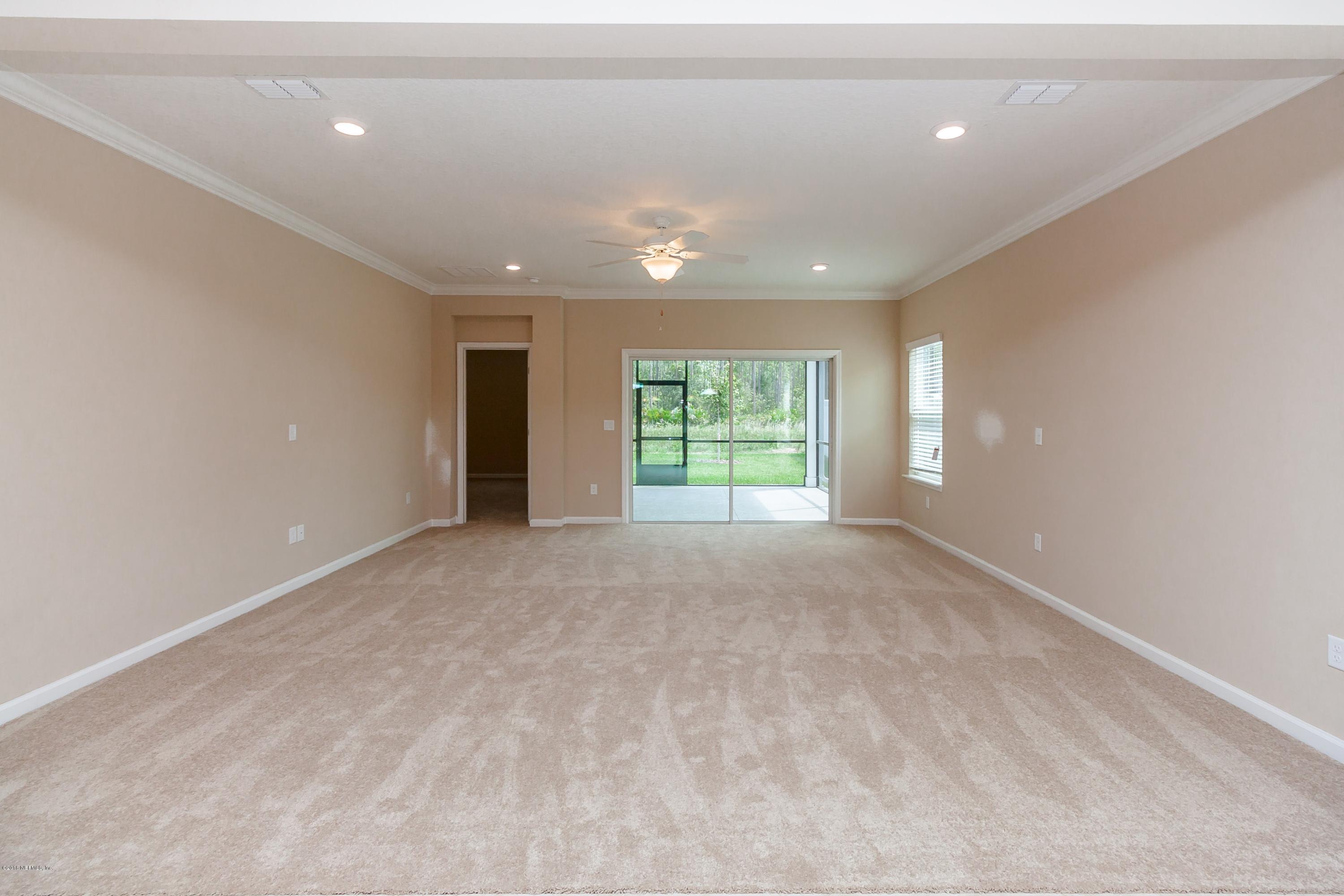 15714 Tisons Bluff Road Jacksonville, FL 32218 - Photo 20 of 44 a view of an empty room with a window