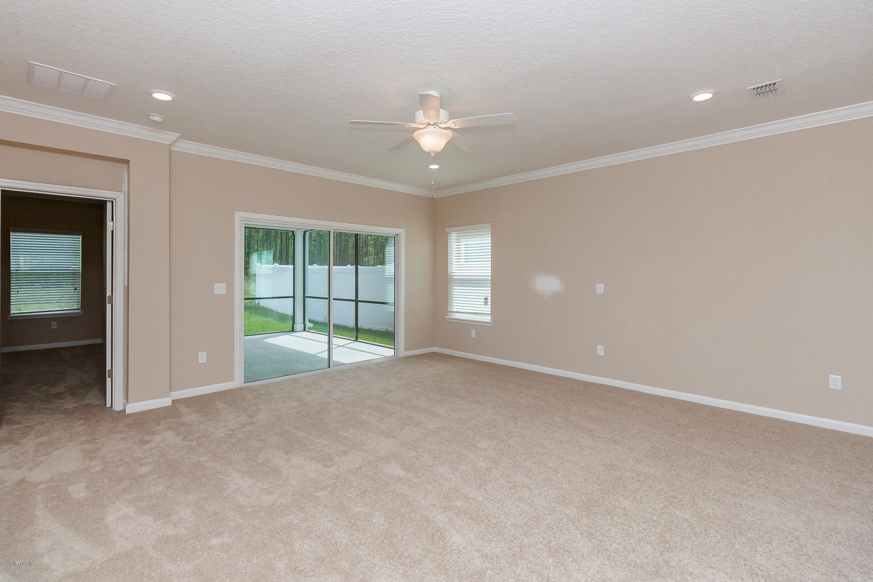 15714 Tisons Bluff Road Jacksonville, FL 32218 - Photo 21 of 44 a view of an empty room with a window