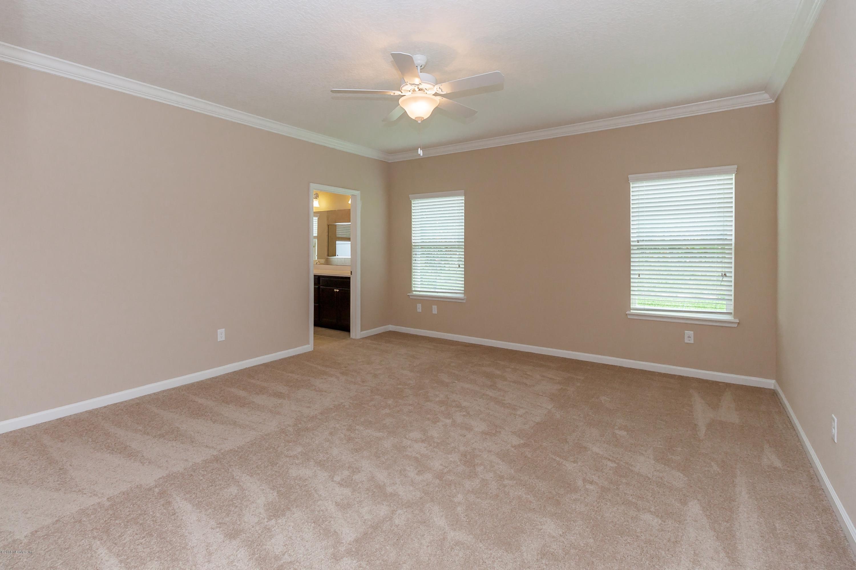 15714 Tisons Bluff Road Jacksonville, FL 32218 - Photo 25 of 44 a view of an empty room with a window