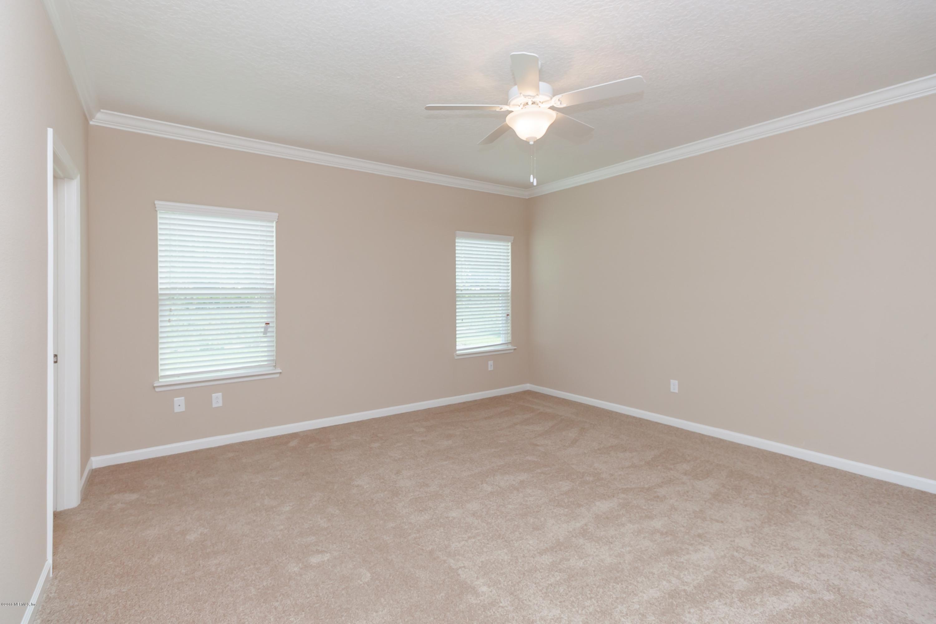 15714 Tisons Bluff Road Jacksonville, FL 32218 - Photo 26 of 44 a view of an empty room with a window