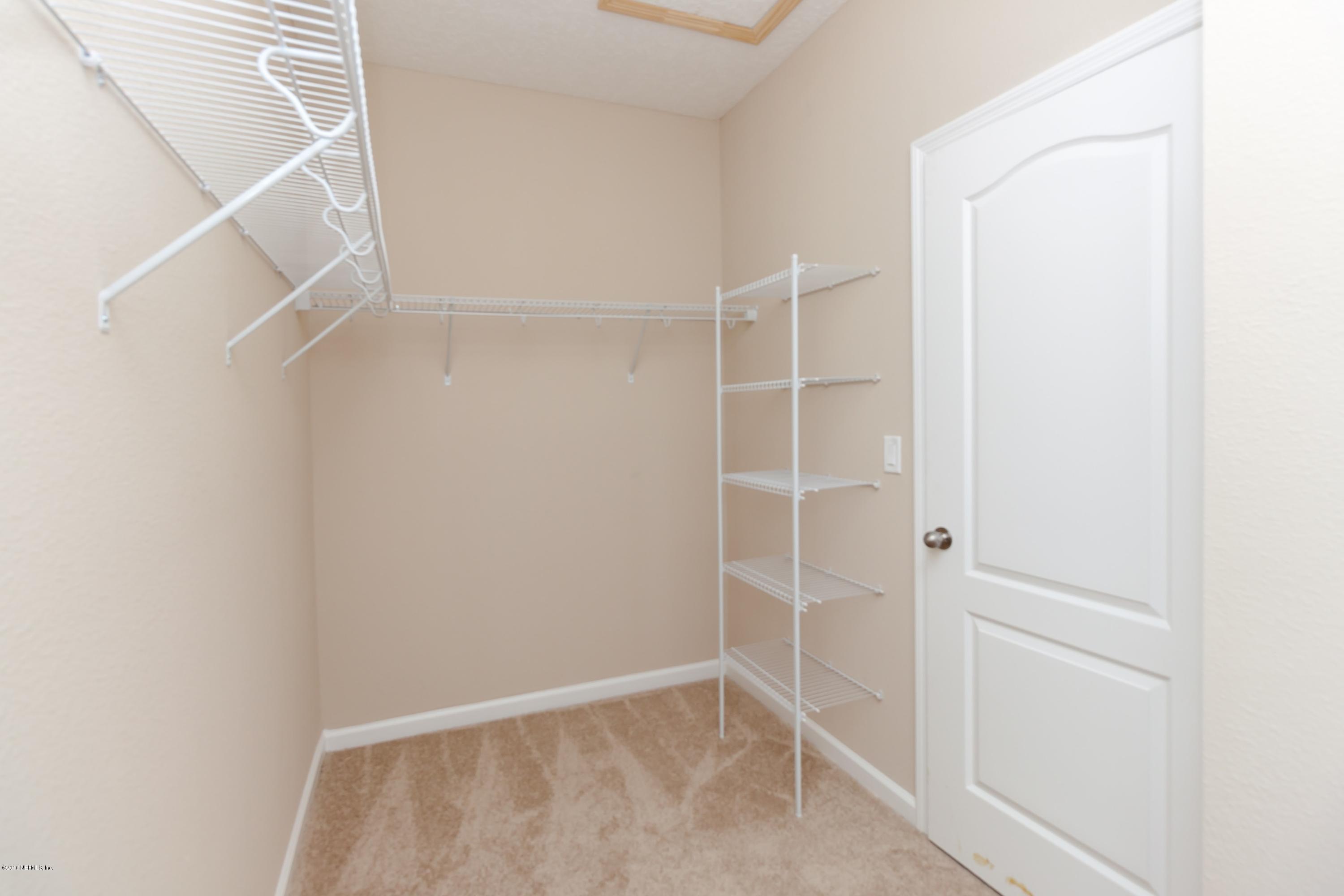15714 Tisons Bluff Road Jacksonville, FL 32218 - Photo 32 of 44 a view of an empty walk in closet