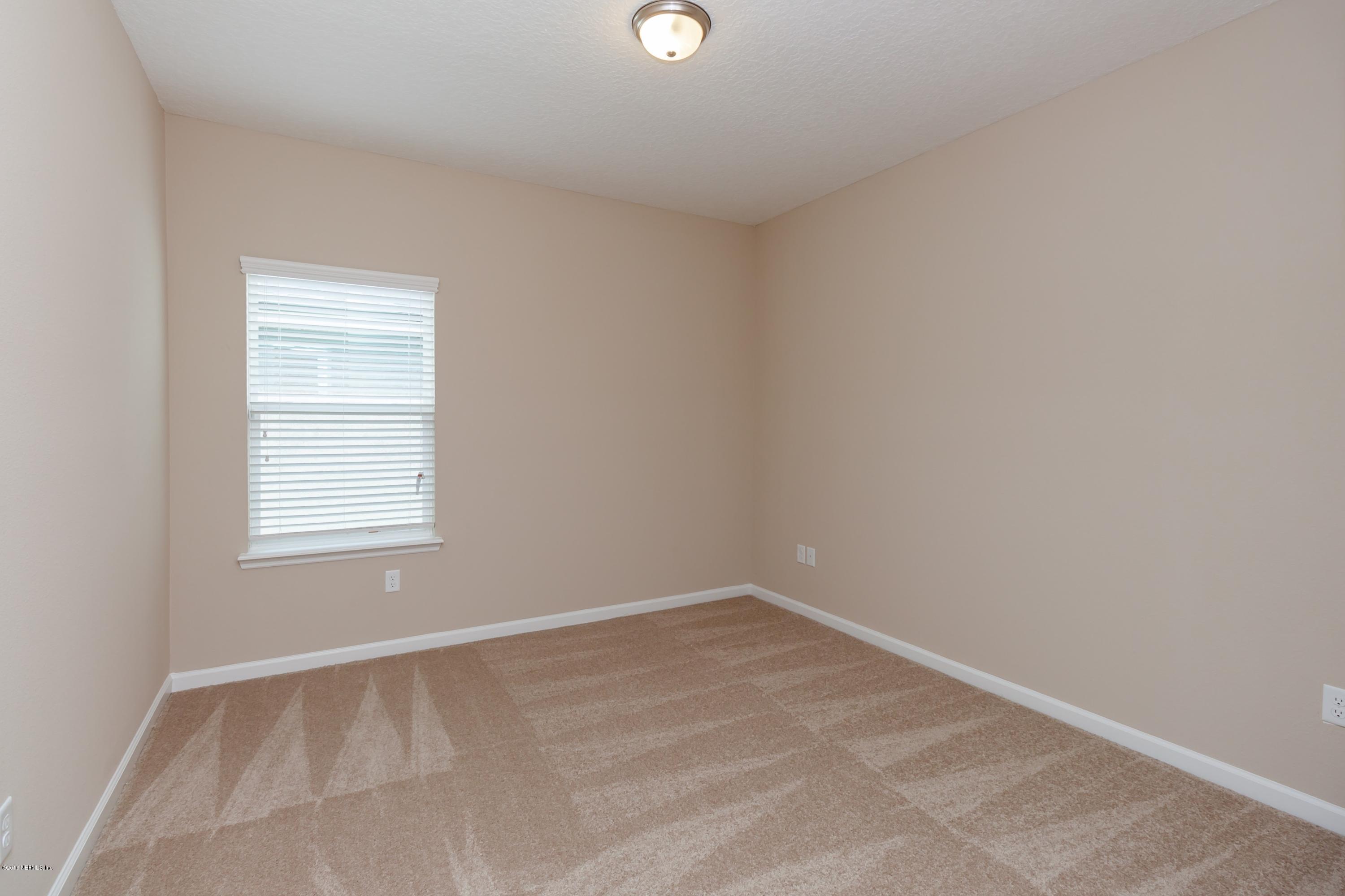 15714 Tisons Bluff Road Jacksonville, FL 32218 - Photo 34 of 44 an empty room with a window