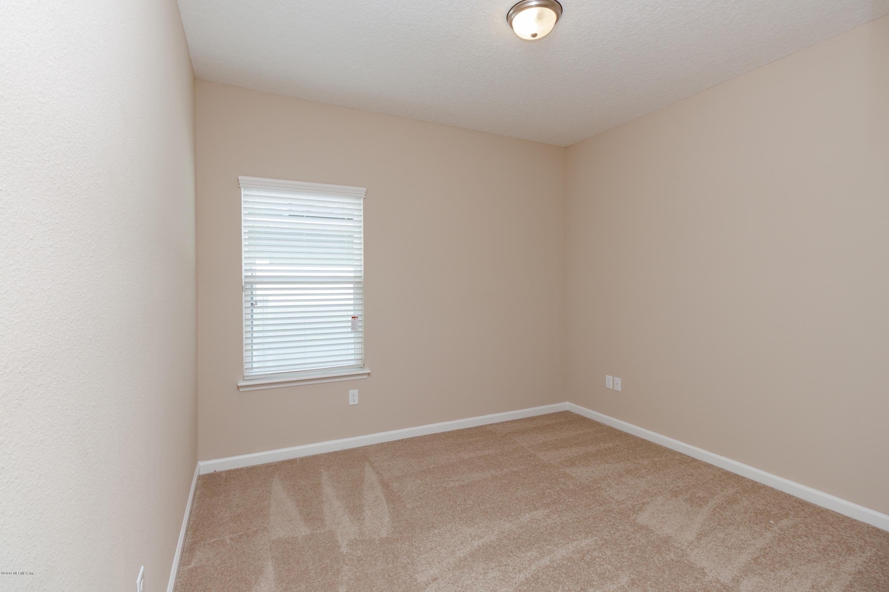 15714 Tisons Bluff Road Jacksonville, FL 32218 - Photo 35 of 44 an empty room with a window