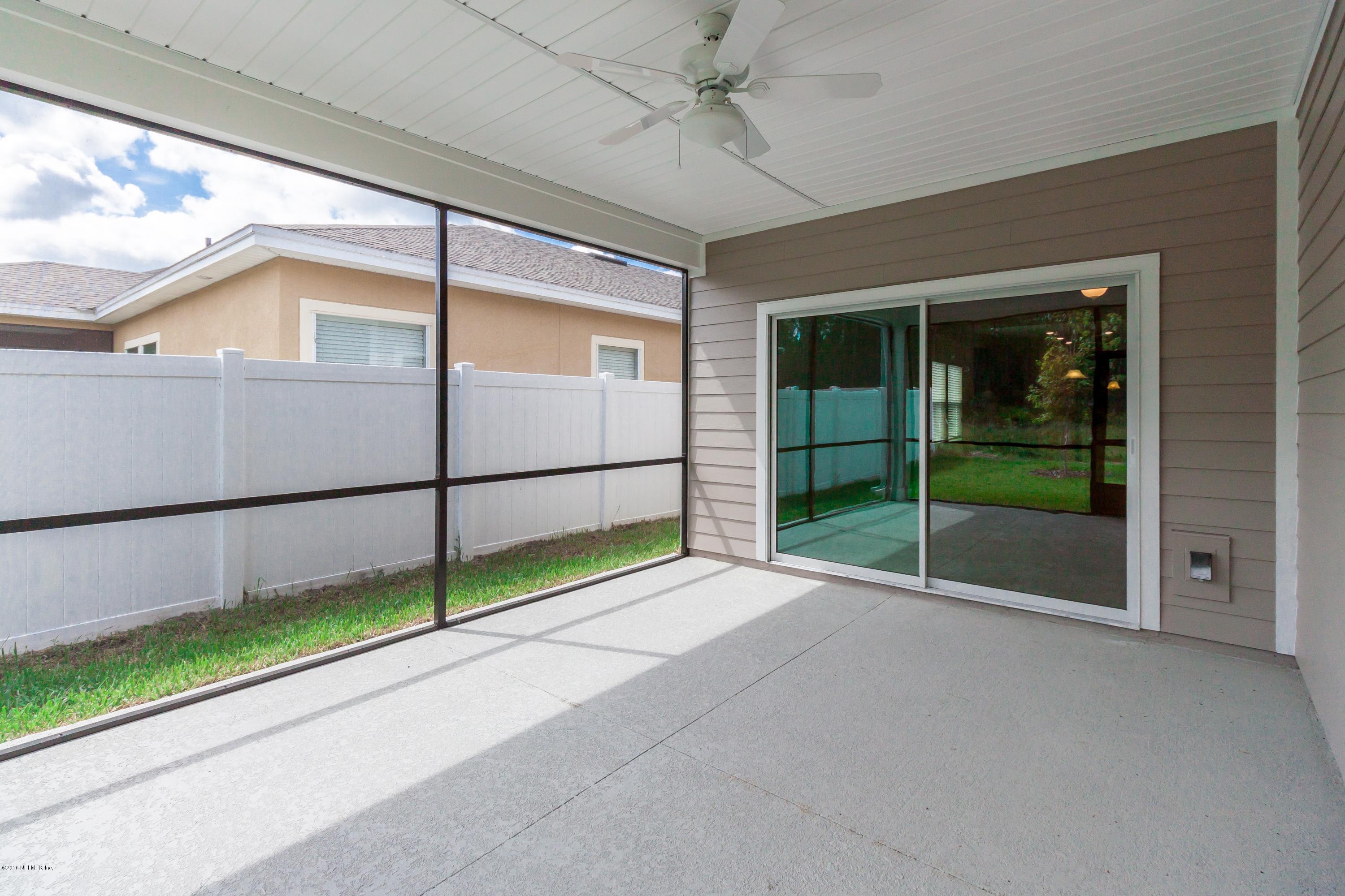15714 Tisons Bluff Road Jacksonville, FL 32218 - Photo 40 of 44 a view of an empty room with sliding door