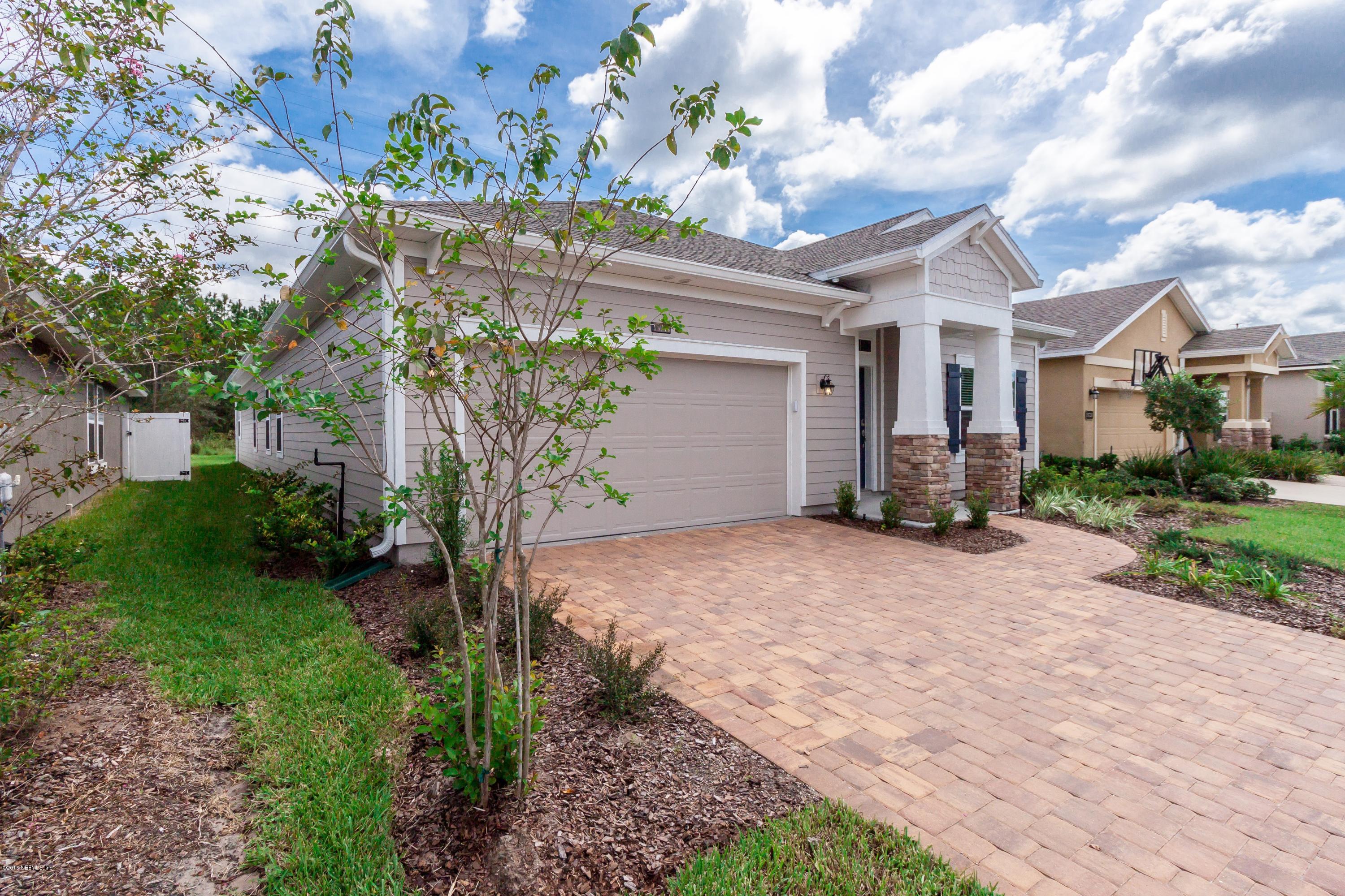 15714 Tisons Bluff Road Jacksonville, FL 32218 - Photo 5 of 44 a front view of a house with a yard and garage