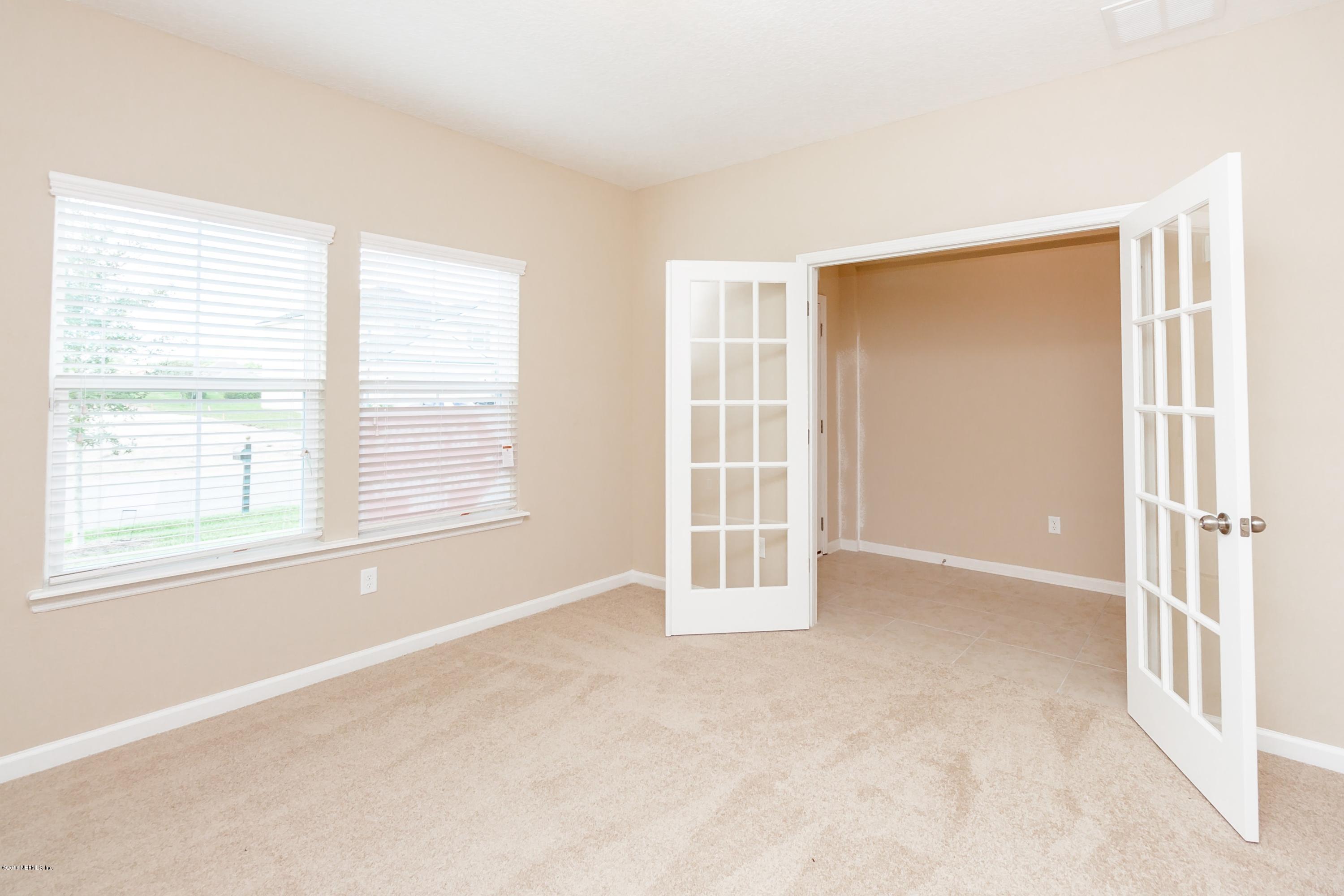 15714 Tisons Bluff Road Jacksonville, FL 32218 - Photo 8 of 44 an empty room with windows