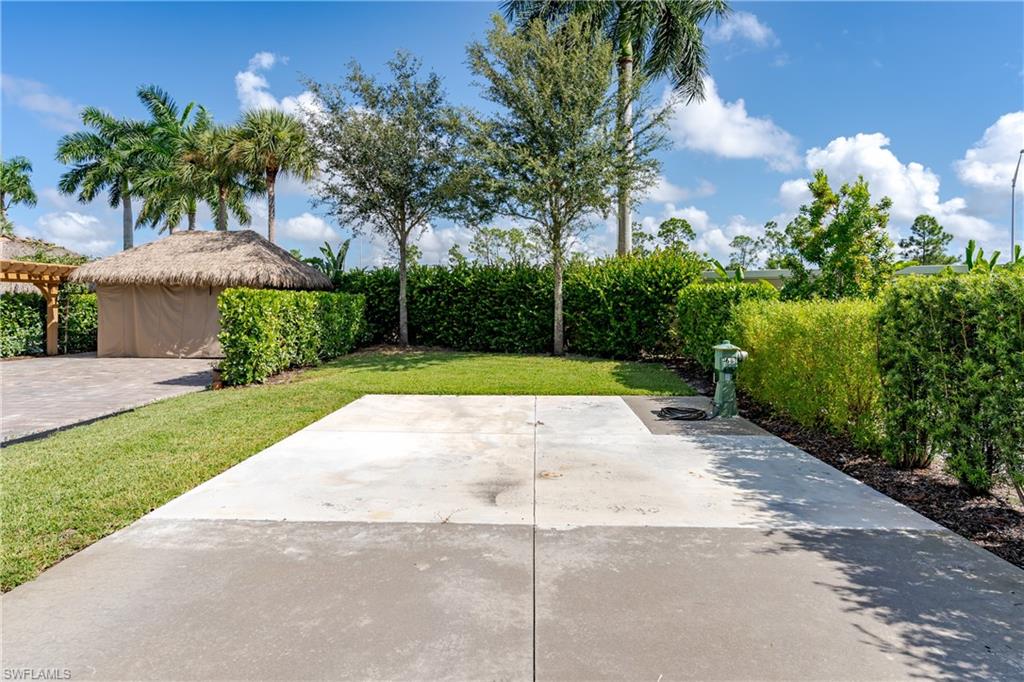 13611 Snook Circle Naples, FL 34114 - Photo 12 of 47 a view of a backyard with a garden