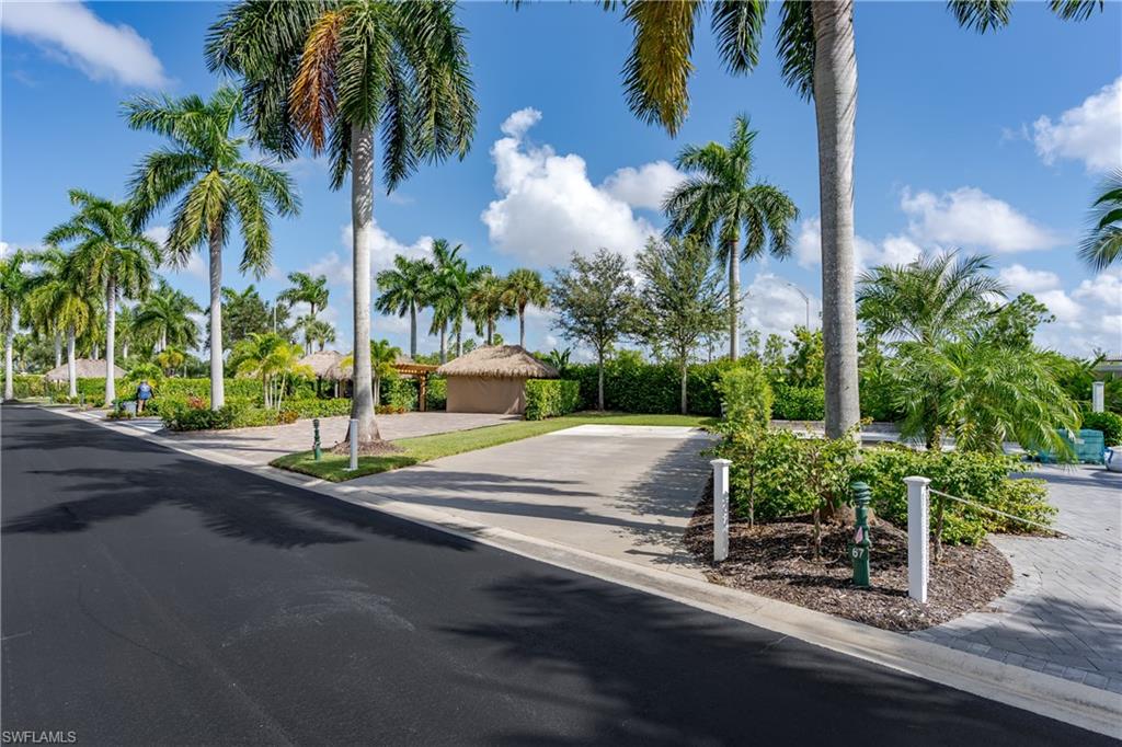 13611 Snook Circle Naples, FL 34114 - Photo 2 of 47 a view of a street with a palm tree