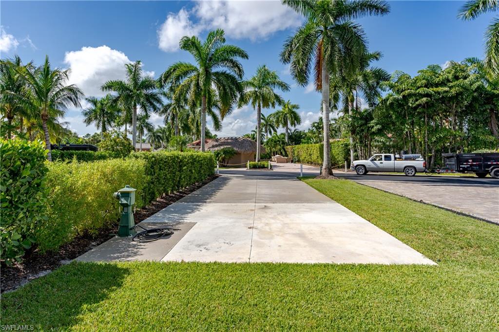 13611 Snook Circle Naples, FL 34114 - Photo 24 of 47 a view of a backyard with a garden