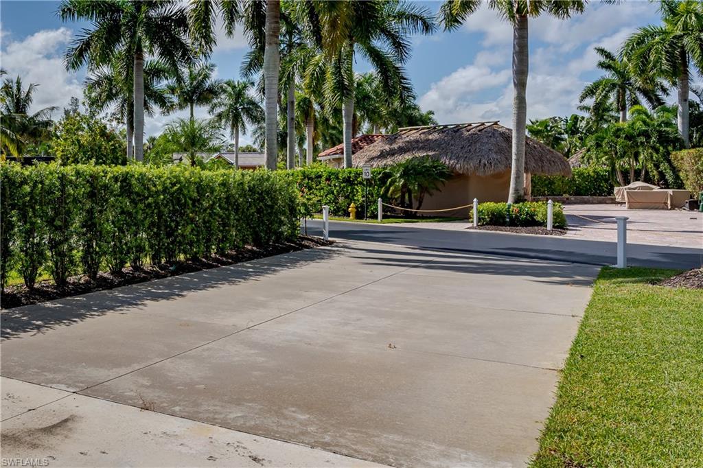13611 Snook Circle Naples, FL 34114 - Photo 34 of 47 a view of a garden with palm trees