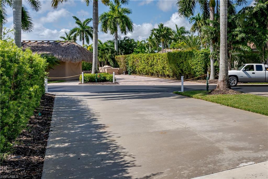 13611 Snook Circle Naples, FL 34114 - Photo 36 of 47 a view of backyard with swimming pool and trees