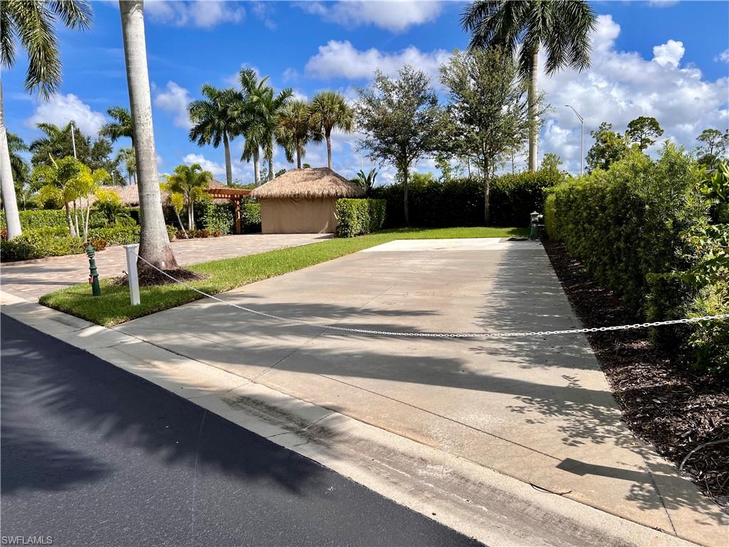 13611 Snook Circle Naples, FL 34114 - Photo 4 of 47 a view of a house with a yard