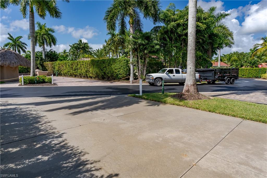 13611 Snook Circle Naples, FL 34114 - Photo 41 of 47 a garden view with a sitting space