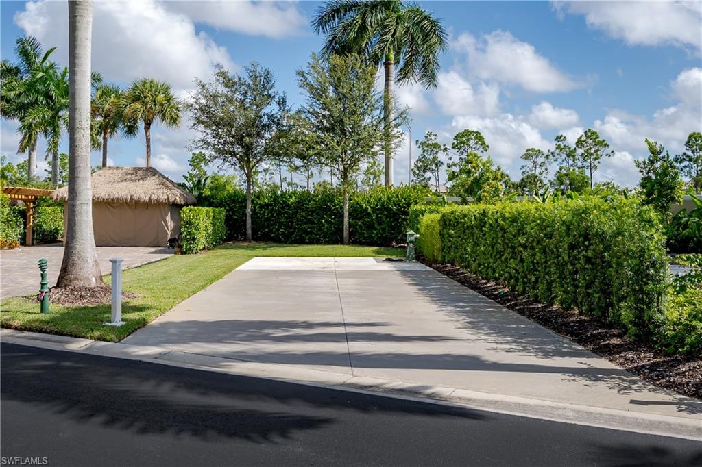 13611 Snook Circle Naples, FL 34114 - Photo 7 of 47 a view of a backyard with potted plants
