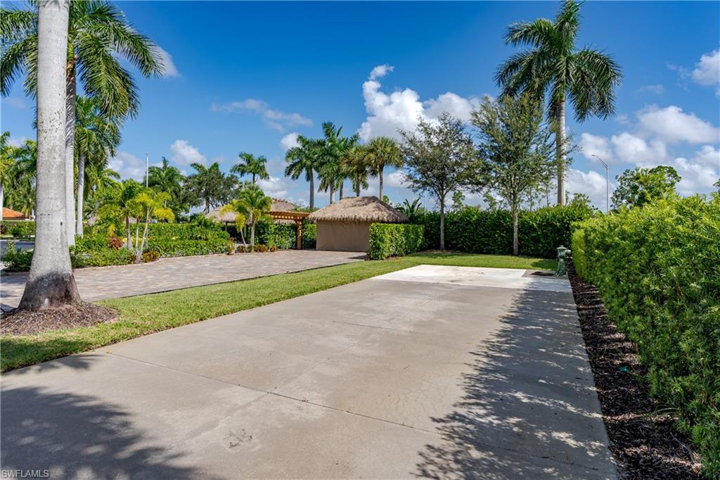 13611 Snook Circle Naples, FL 34114 - Photo 8 of 47 a view of a yard with plants