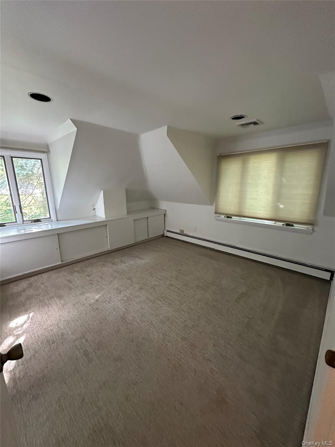 5 Beverly Road Port Washington, NY 11050 - Photo 3 of 10 an empty room with a empty space and windows