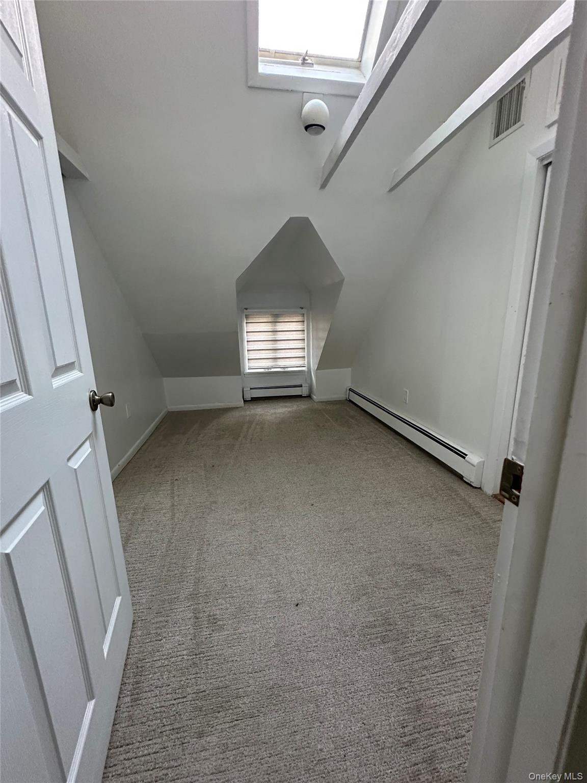 5 Beverly Road Port Washington, NY 11050 - Photo 9 of 10 a view of empty room with wooden floor and fan