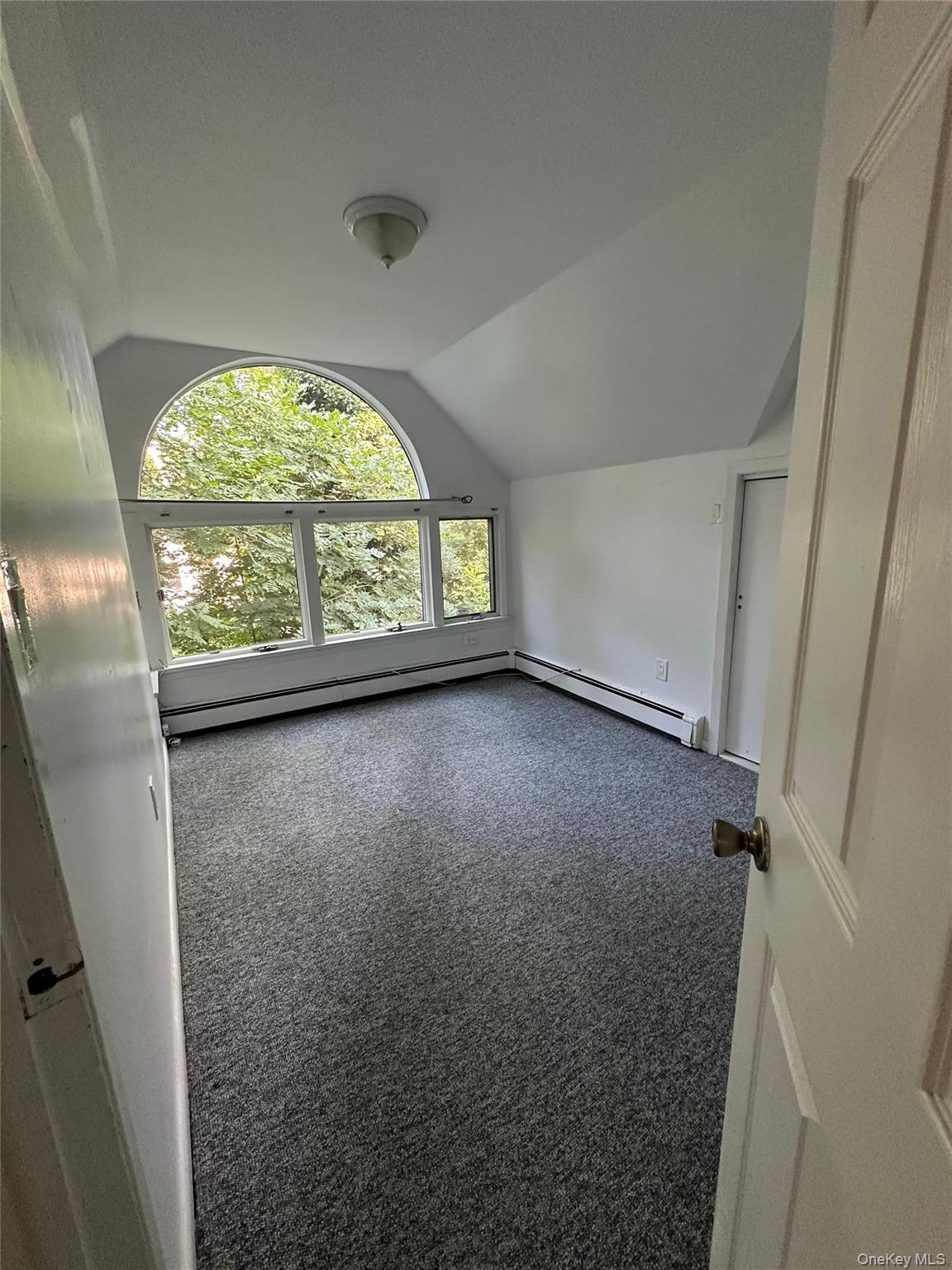 5 Beverly Road Port Washington, NY 11050 - Photo 10 of 10 a view of an empty room with a window