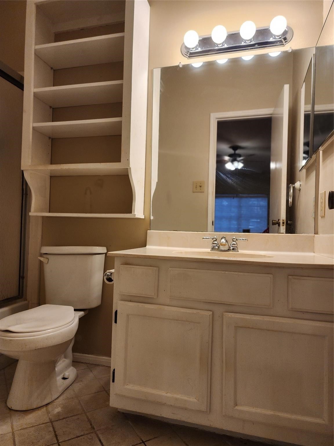 7399 Regency Square Court, Unit 7399 Houston, TX 77036 - Photo 15 of 27 a bathroom with a toilet and a sink