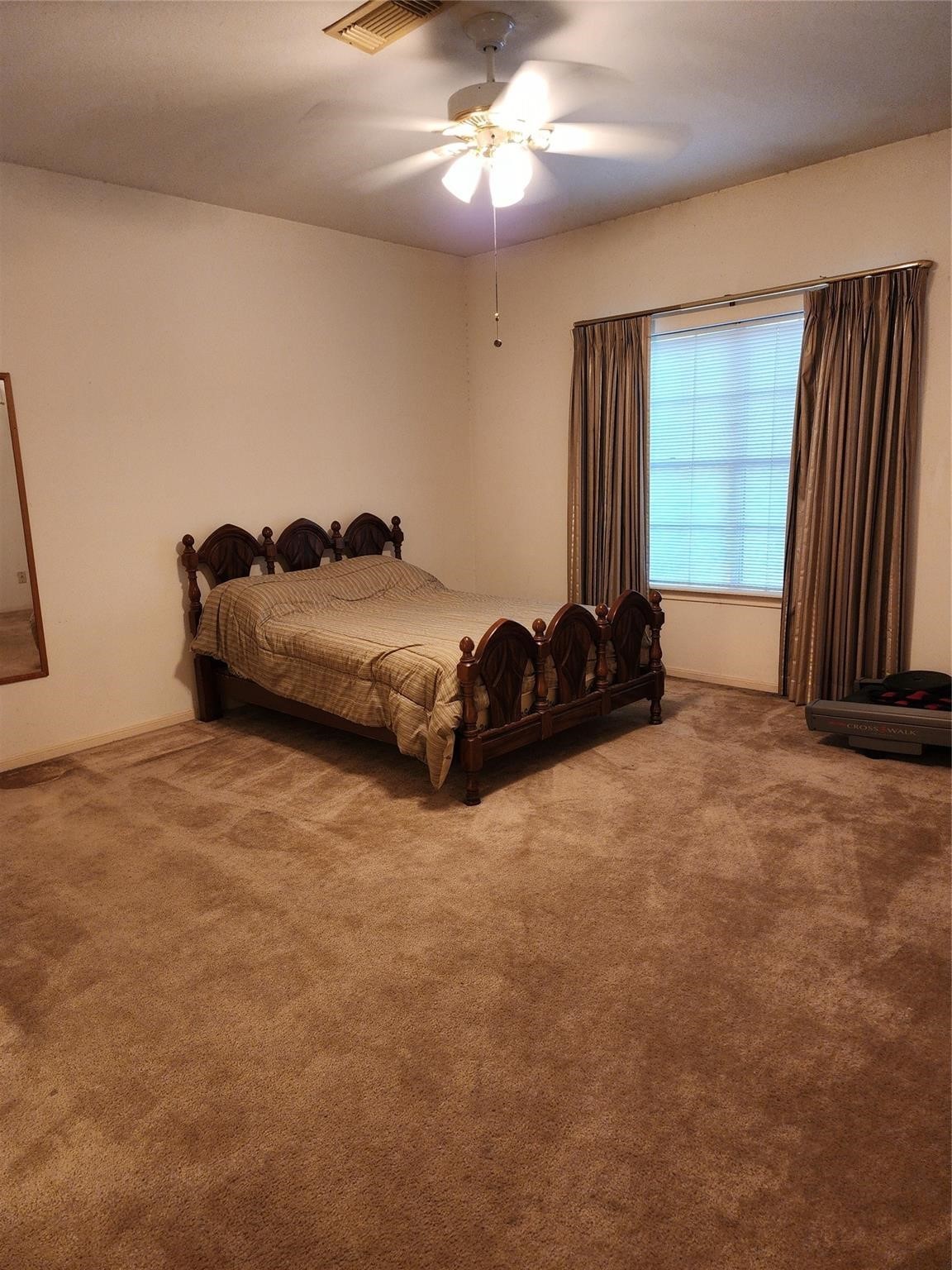 7399 Regency Square Court, Unit 7399 Houston, TX 77036 - Photo 16 of 27 a bedroom with a bed and a window