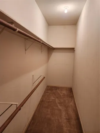 a view of a room with racks on the wall
