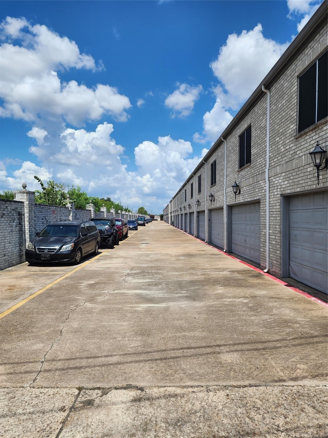 7399 Regency Square Court, Unit 7399 Houston, TX 77036 - Photo 22 of 27 a view of garage with wooden floor