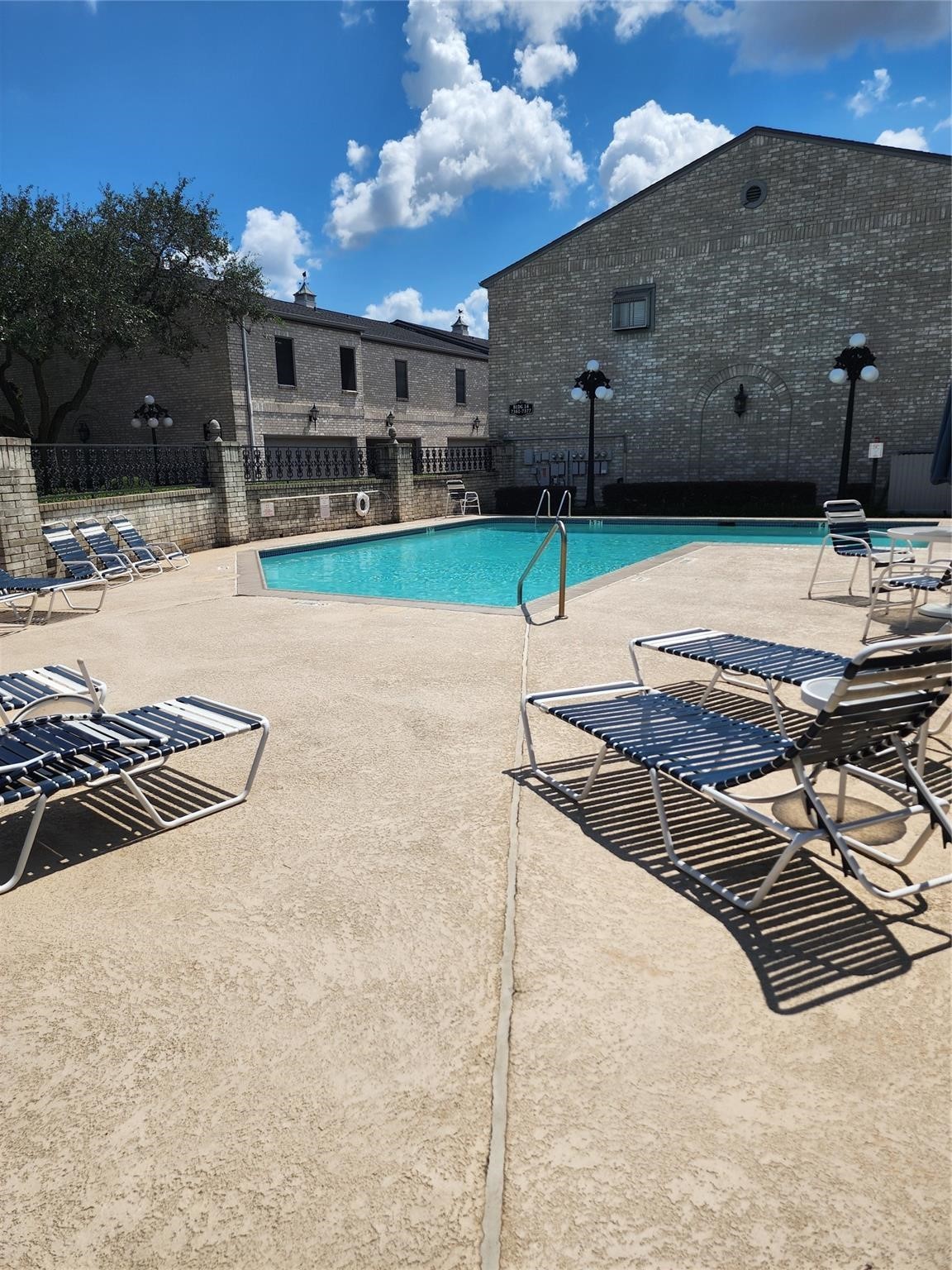 7399 Regency Square Court, Unit 7399 Houston, TX 77036 - Photo 23 of 27 a view of a backyard with sitting area