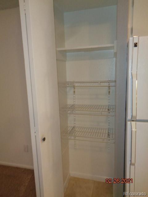 1300 South Parker Road, Unit 112 Denver, CO 80231 - Photo 2 of 15 a bathroom with a bathtub